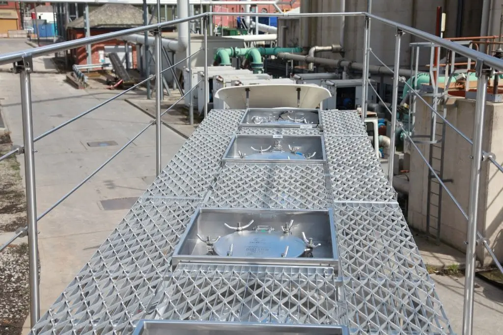 Catwalk with twin ground level operated handrails